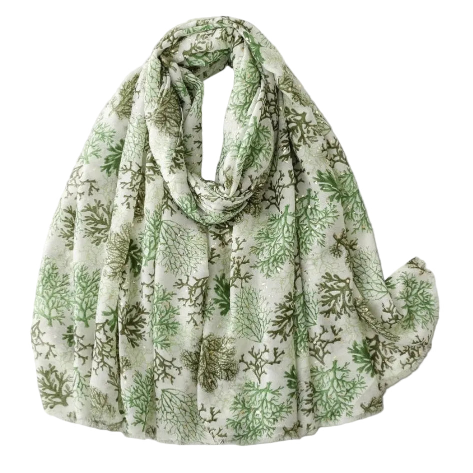 Green and white patterned scarf on a light gray background
