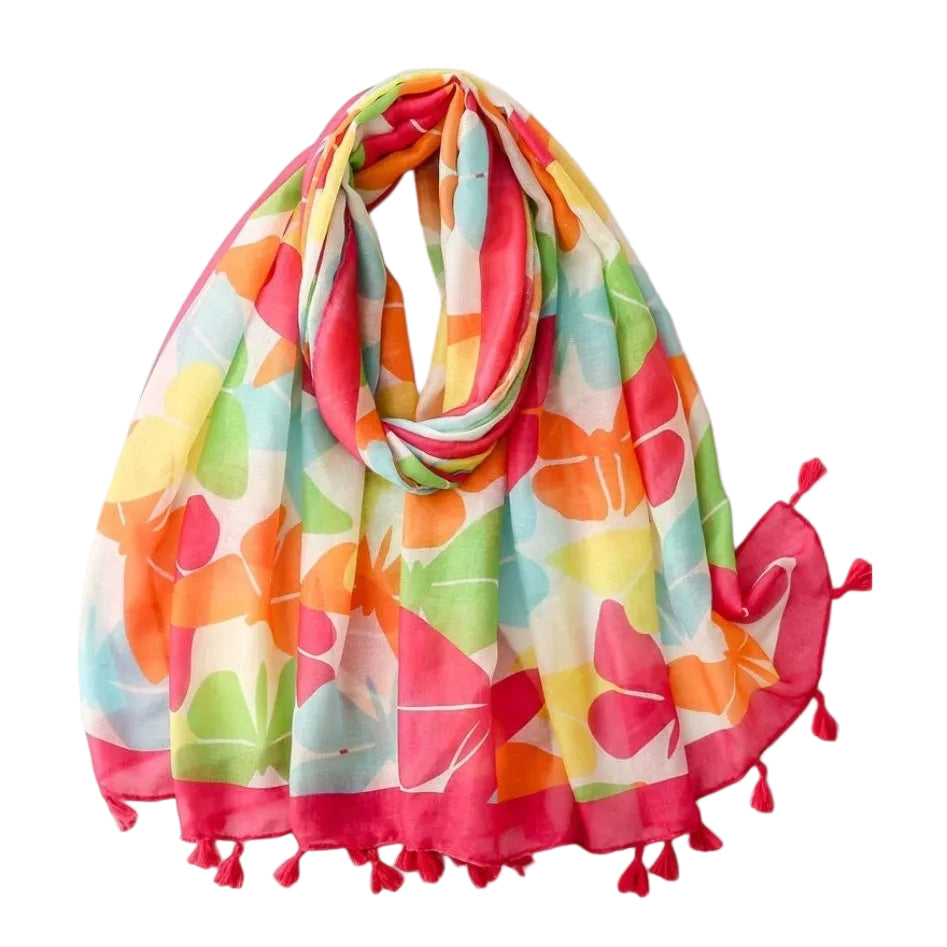 Colorful floral scarf with tassels on a light gray background
