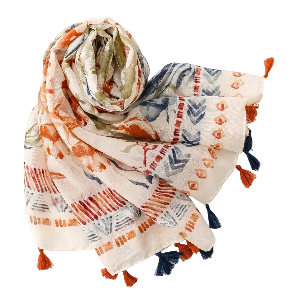 Colorful patterned scarf with tassels on a light gray background