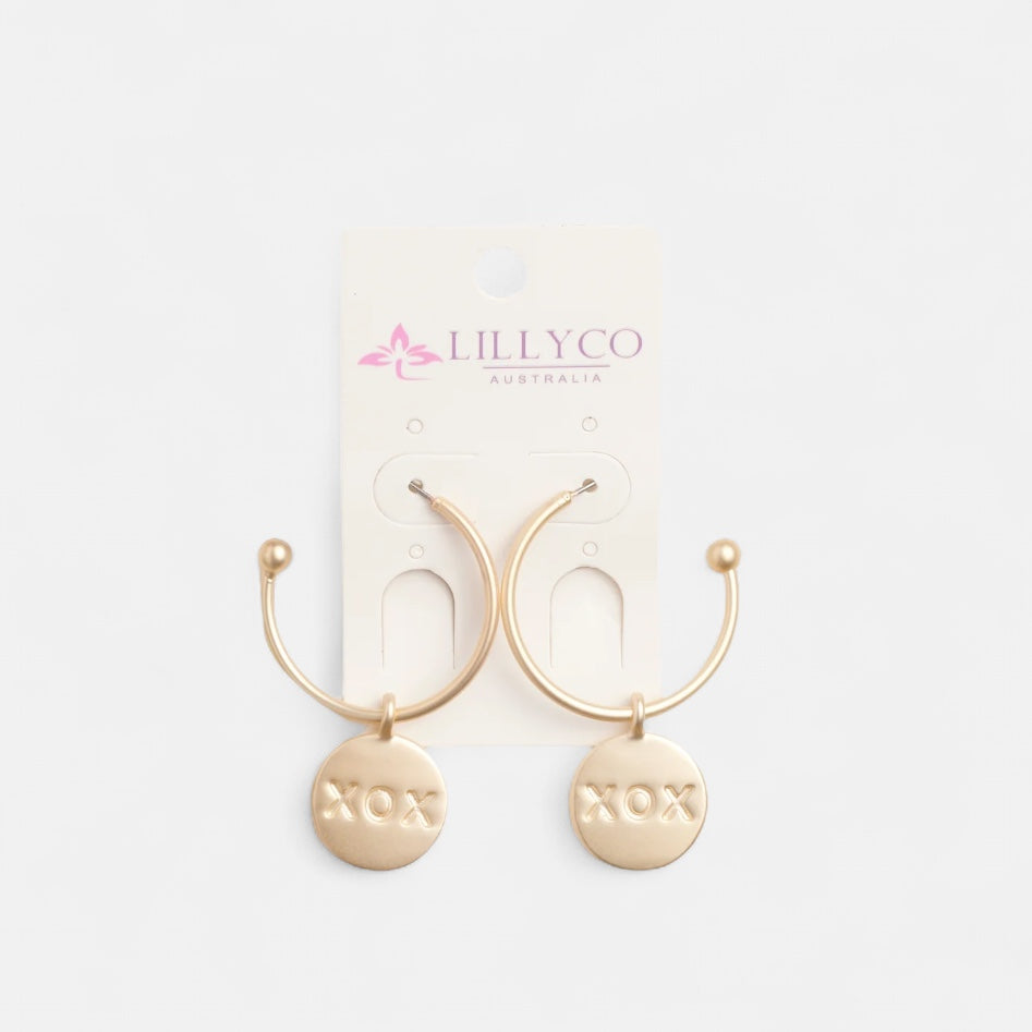 Gold hoop earrings with 'NOX' labels on a white background, branded with Lillyco Australia.