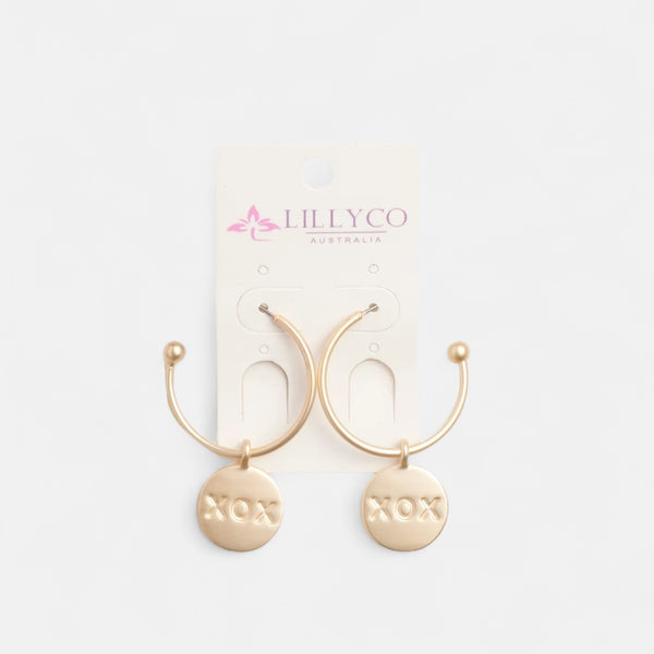 Gold hoop earrings with 'NOX' labels on a white background, branded with Lillyco Australia.